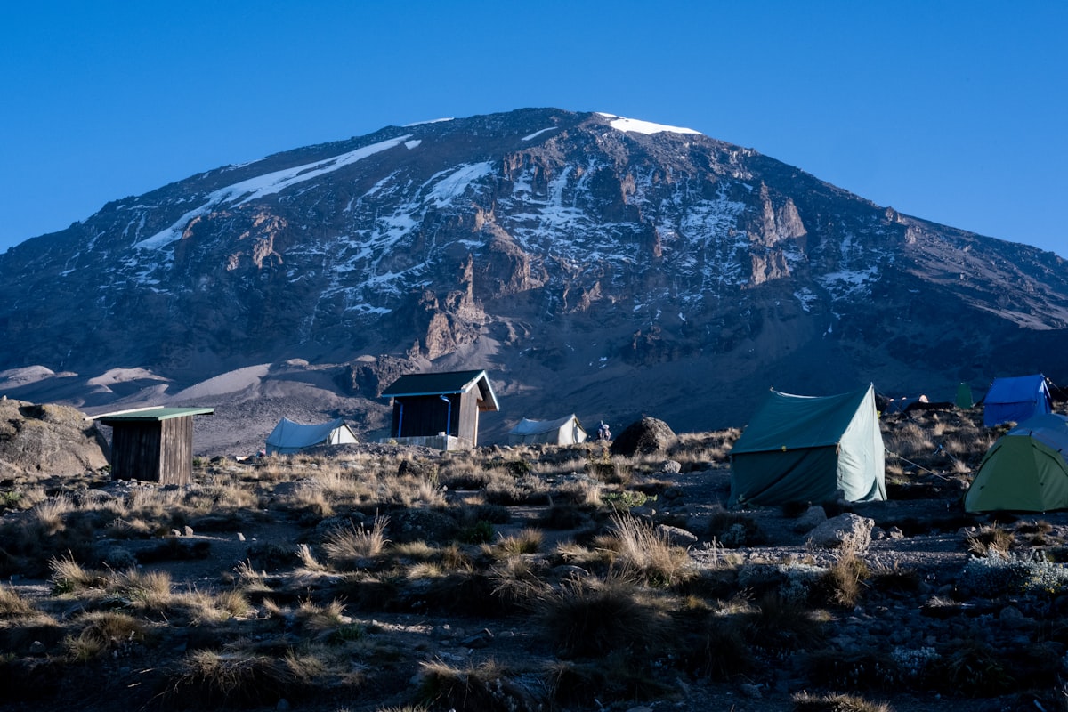 Camp tents with Kibo glaciers and peak in background