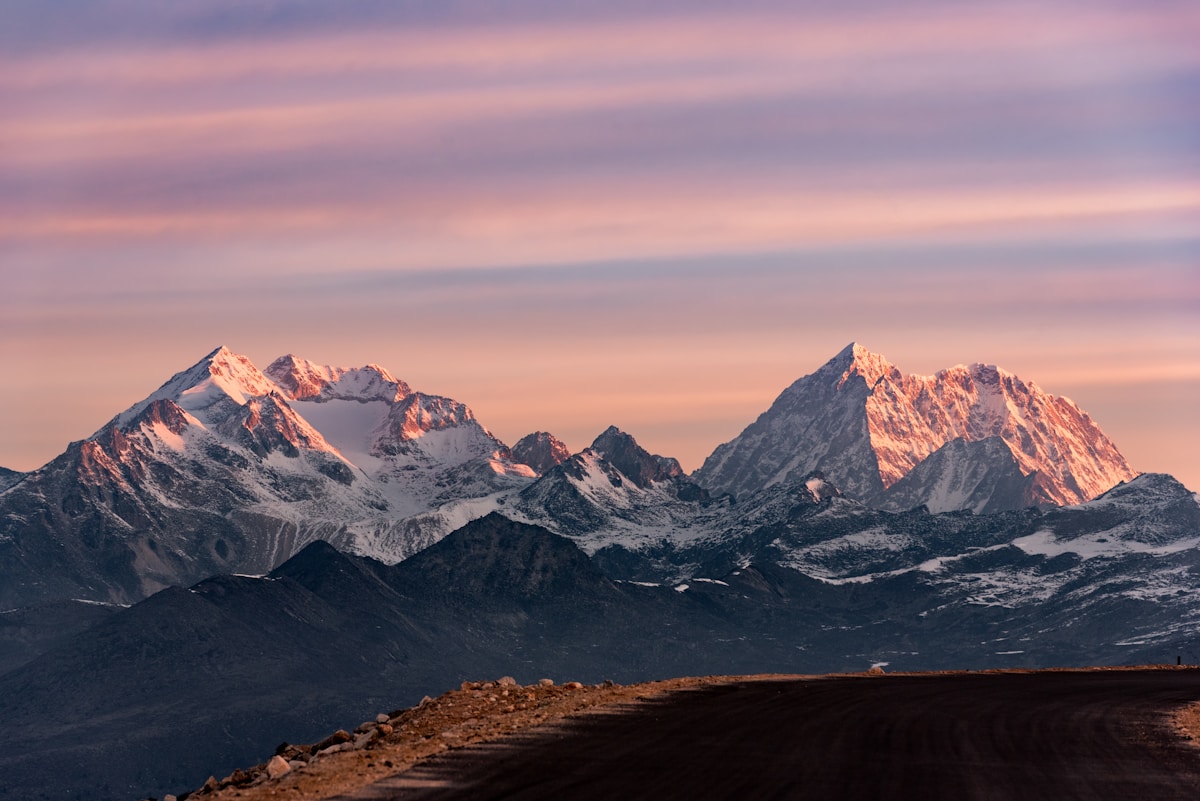 A sweeping mountain valley with dramatic cloud formations