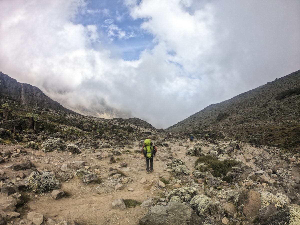 A mountain trail winding through highland terrain